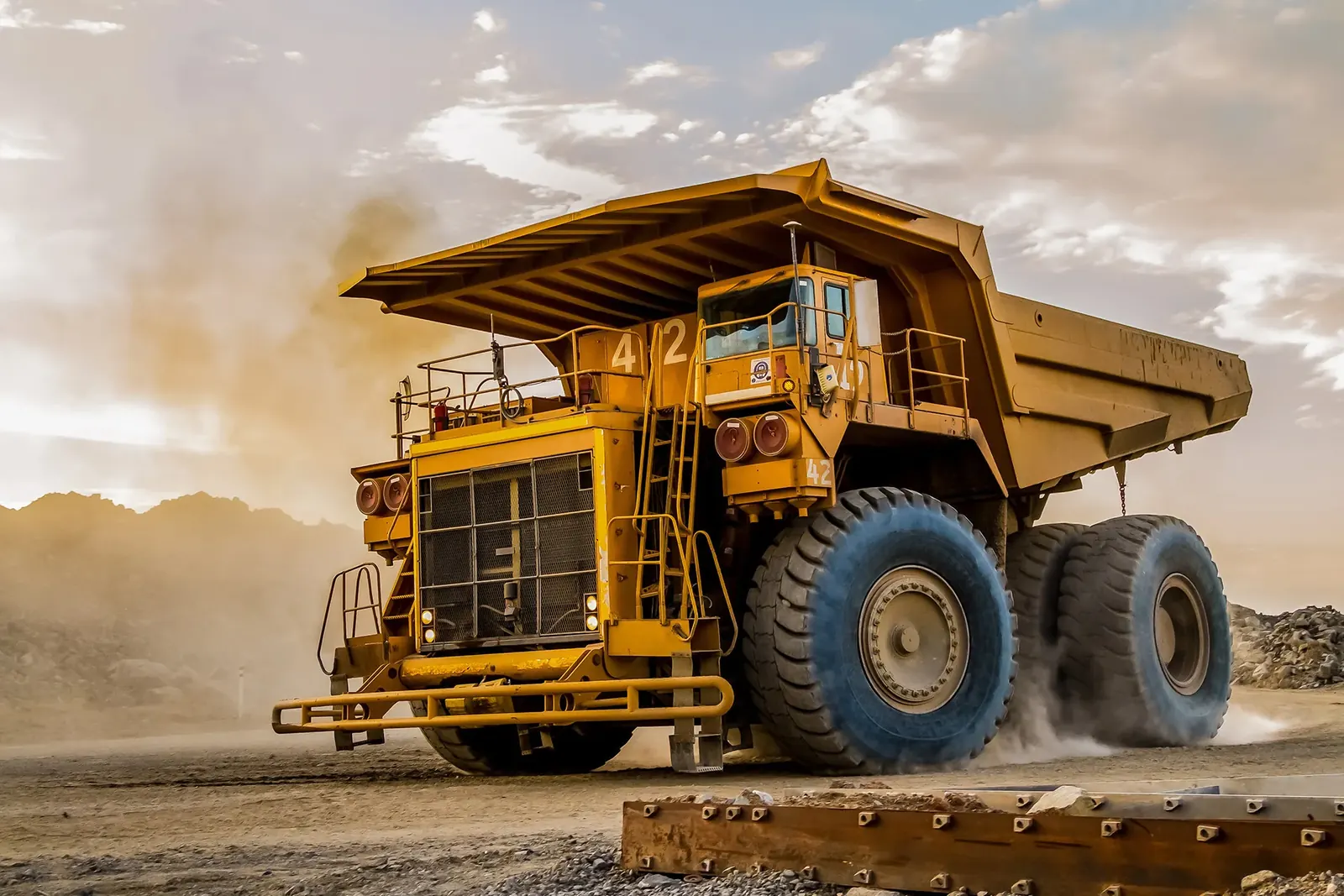 Ore haulage control: load weight and satellite